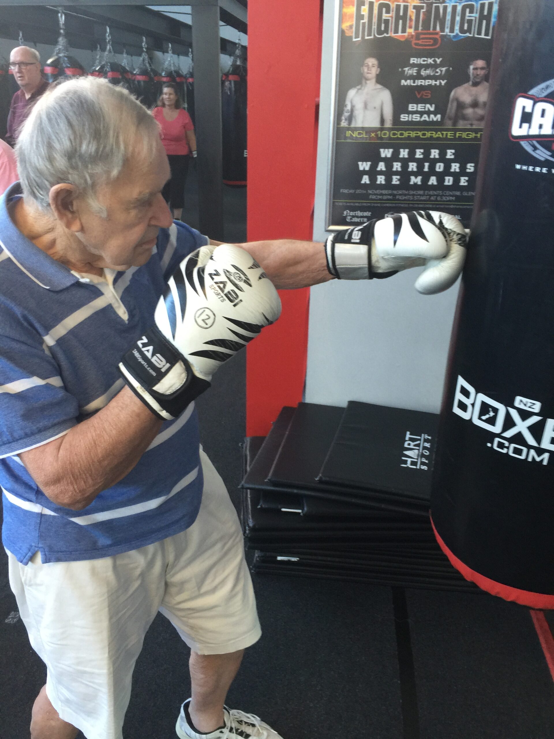 An older boxer wearing gloves during a Counterpunch Parkinson’s class
